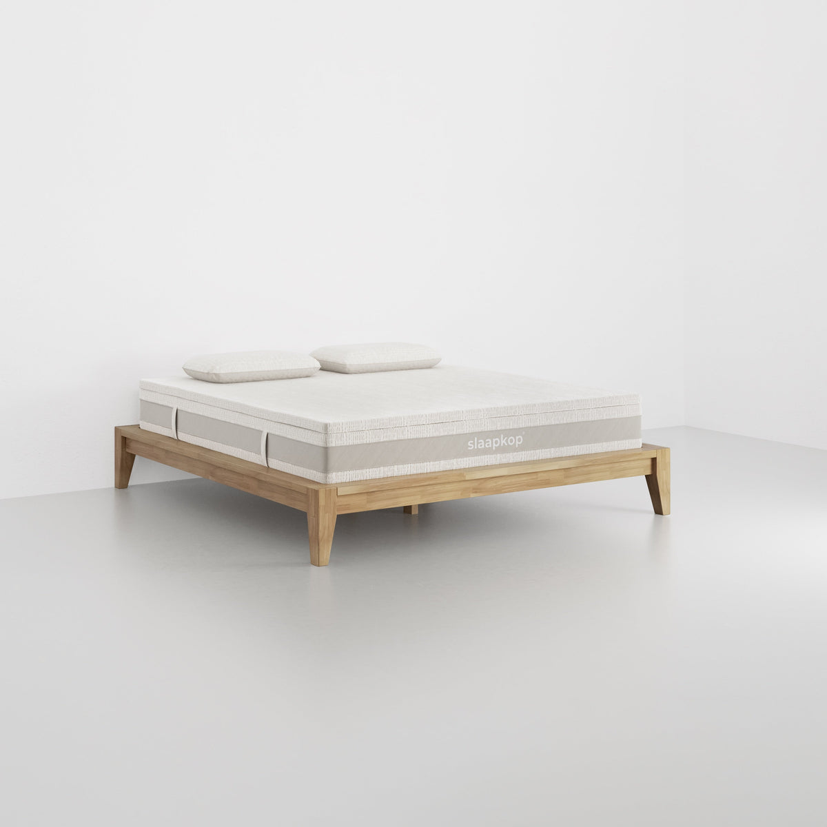 slaapkop The Frame bedframe in natural rubber wood, angled view, 180 cm width