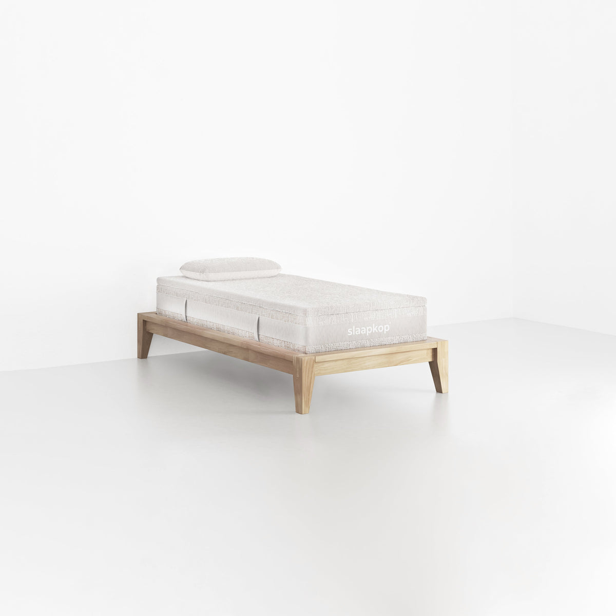 slaapkop The Frame bedframe in natural rubber wood, angled view, 90 cm width