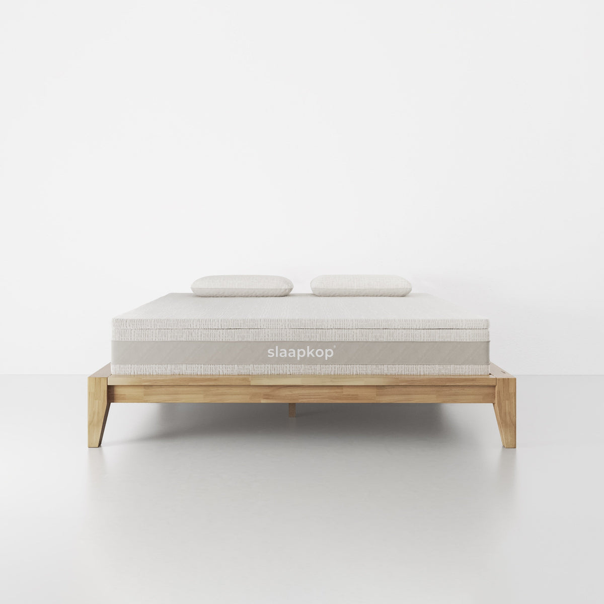 slaapkop The Frame bedframe in natural rubber wood, front view, 180 cm width
