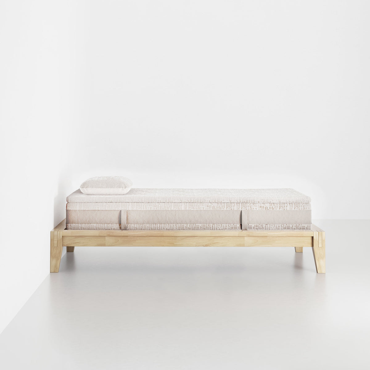 slaapkop The Frame bedframe in natural rubber wood, side view, 90 cm width