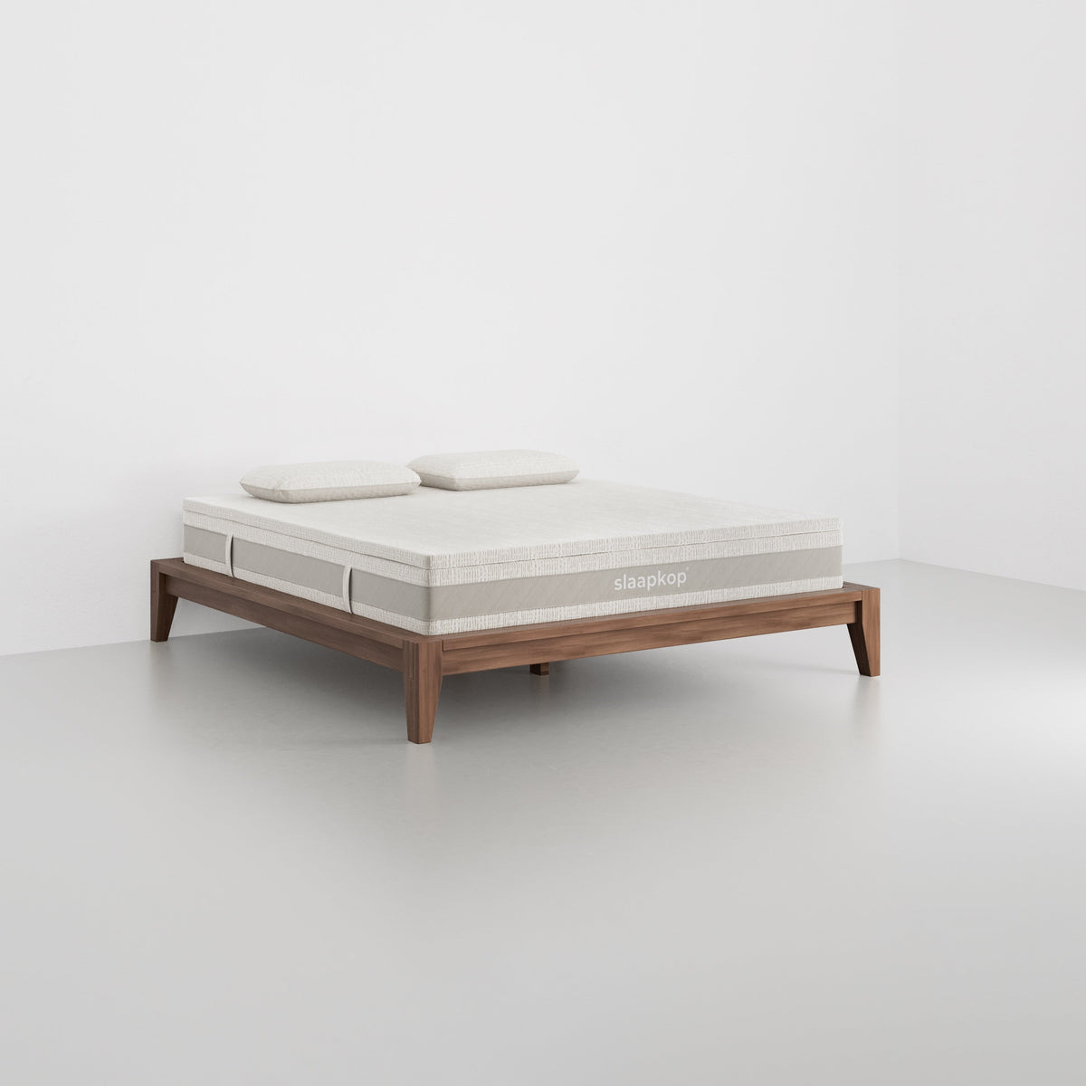 slaapkop The Frame bedframe in walnut rubber wood, angled view, 180 cm width