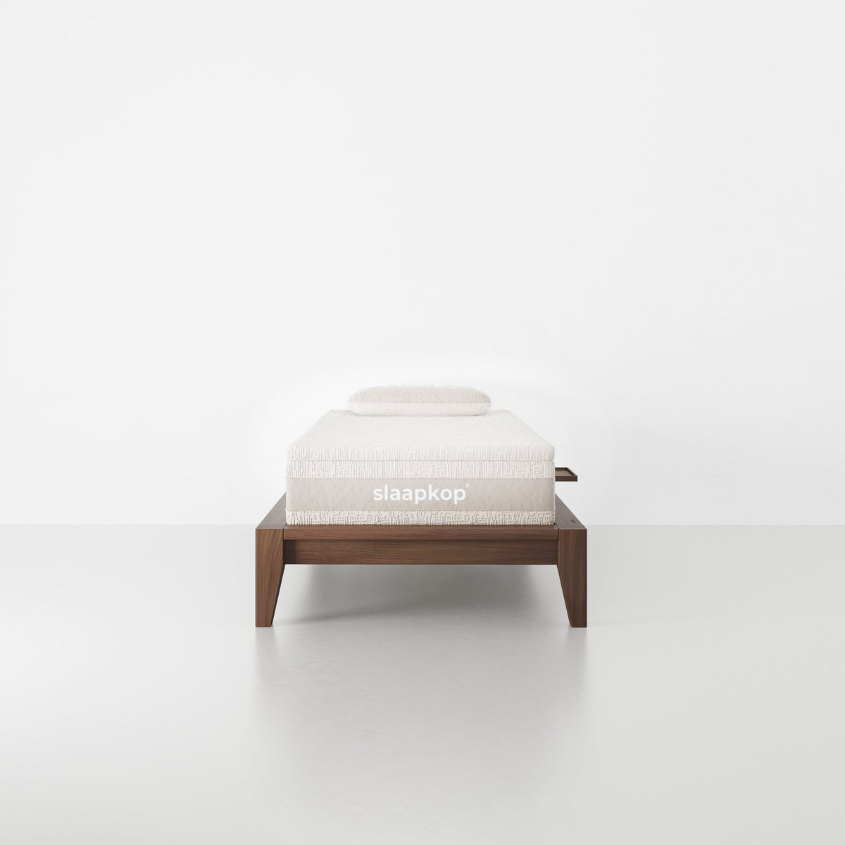 slaapkop The Frame bedframe in walnut rubber wood, front view, 90 cm width